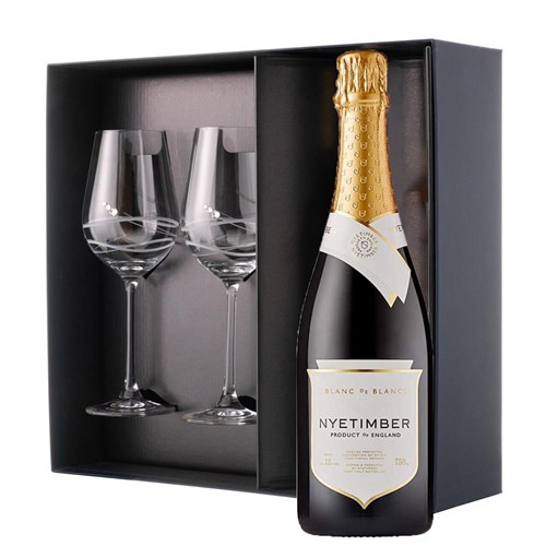 This luxurious gift set is the perfect choice for those who appreciate fine sparkling wine and refined glassware. Featuring a bottle of Nyetimber Blanc de Blancs English Sparkling 75cl paired with two exquisite Venezia Glasses adorned with Swarovski Crystals, this set is beautifully presente